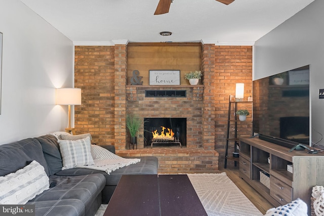 7819 Oak St, Manassas, VA 20111 - living area featuring ceiling fan, brick wall, and a fireplace