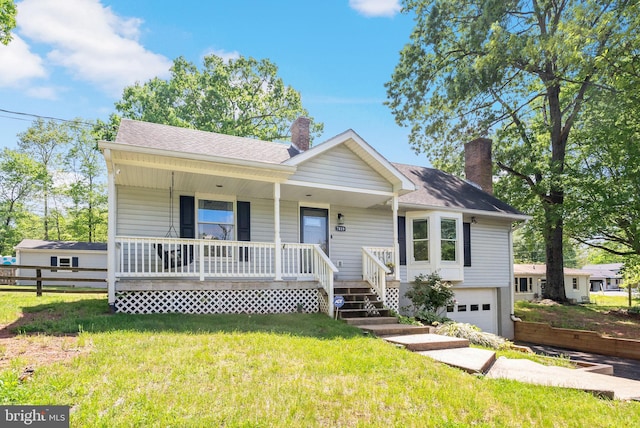 view of front facade featuring a shingled roof, a garage, a porch, a front yard, and a chimney