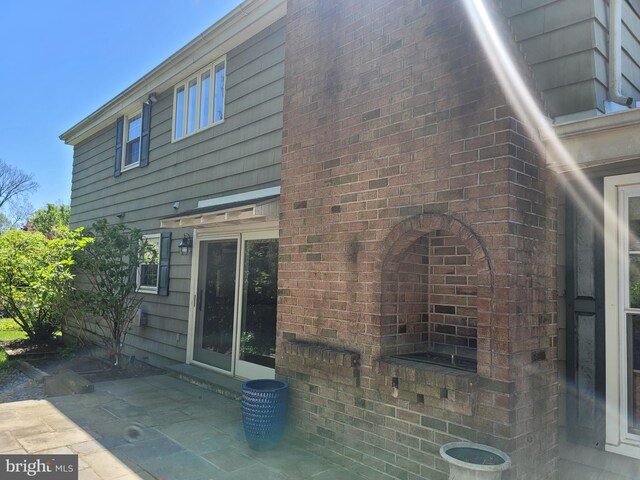 5895 Tibby Rd, Bensalem, PA 19020 - view of side of home featuring a patio area and brick siding