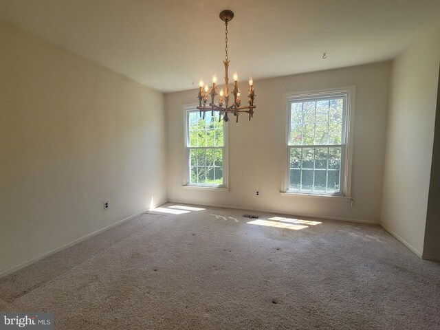 5895 Tibby Rd, Bensalem, PA 19020 - carpeted empty room with a chandelier and baseboards