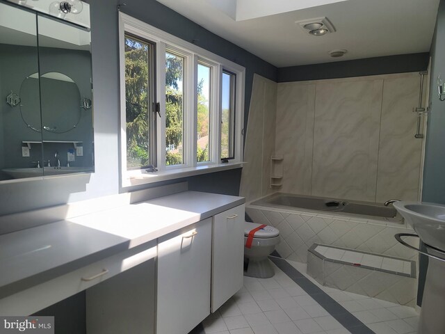 5895 Tibby Rd, Bensalem, PA 19020 - full bath featuring tile patterned flooring, a relaxing tiled tub, toilet, and vanity
