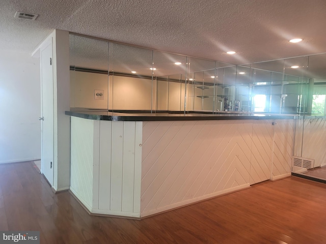 5895 Tibby Rd, Bensalem, PA 19020 - kitchen with wood finished floors, baseboards, and a textured ceiling