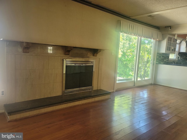 5895 Tibby Rd, Bensalem, PA 19020 - unfurnished living room featuring hardwood / wood-style floors and a textured ceiling