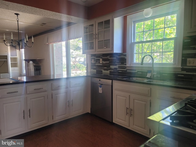 5895 Tibby Rd, Bensalem, PA 19020 - kitchen with stainless steel dishwasher, a sink, backsplash, white cabinets, and a chandelier