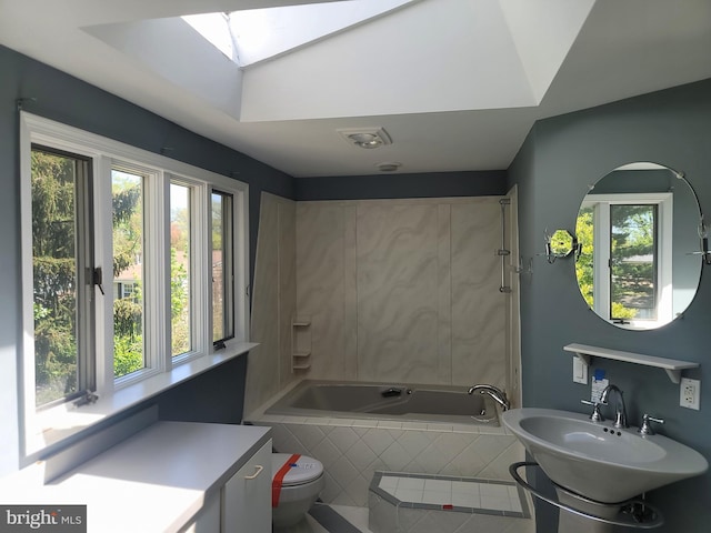 5895 Tibby Rd, Bensalem, PA 19020 - full bath featuring a skylight, tiled tub, and plenty of natural light