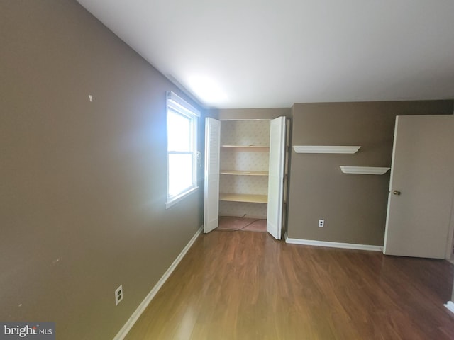 5895 Tibby Rd, Bensalem, PA 19020 - unfurnished bedroom featuring wood finished floors and baseboards