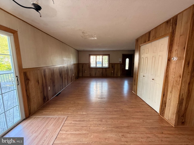 2218 Trenton Ave, Bristol, PA 19007 - corridor featuring wooden walls, light wood-type flooring, and a wainscoted wall