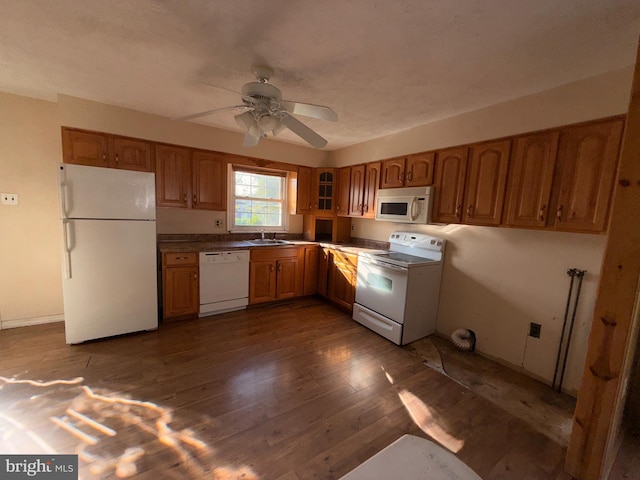 2218 Trenton Ave, Bristol, PA 19007 - kitchen with white appliances, a sink, brown cabinets, ceiling fan, and dark wood-style floors