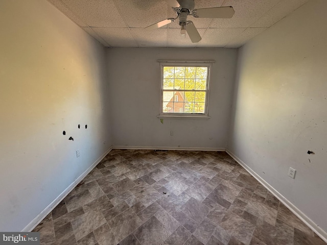 2218 Trenton Ave, Bristol, PA 19007 - empty room featuring a paneled ceiling, ceiling fan, baseboards, and stone finish flooring