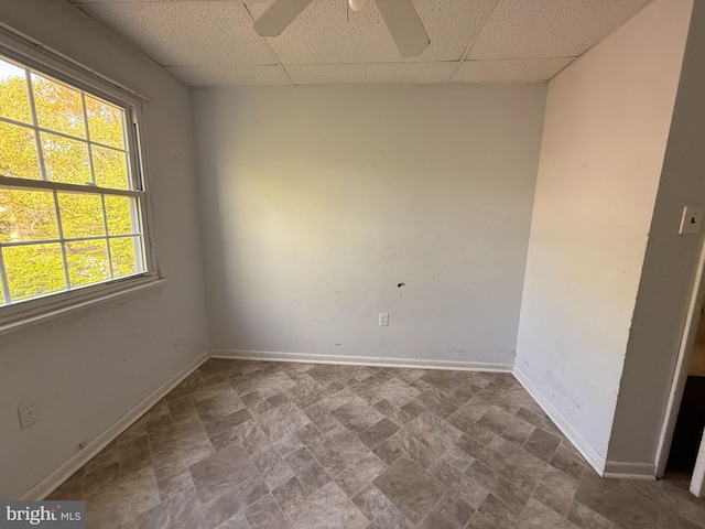 2218 Trenton Ave, Bristol, PA 19007 - spare room featuring a drop ceiling, baseboards, ceiling fan, and stone finish floors