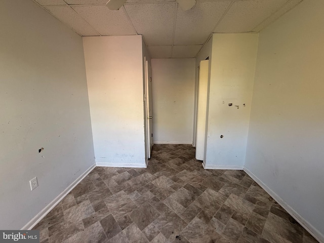 2218 Trenton Ave, Bristol, PA 19007 - unfurnished room with a paneled ceiling, baseboards, and stone finish flooring