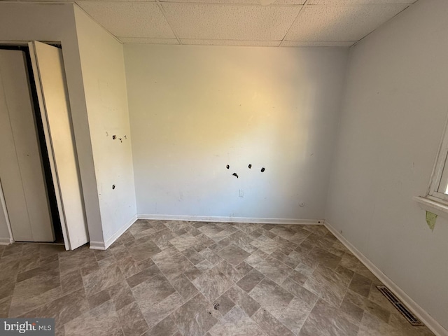 2218 Trenton Ave, Bristol, PA 19007 - unfurnished bedroom featuring a paneled ceiling, stone finish floors, and baseboards