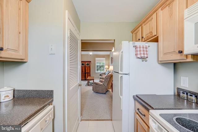 517 Bashford Ln Unit 5, Alexandria, VA 22314 - kitchen featuring light brown cabinets, white appliances, light tile patterned flooring, and light colored carpet