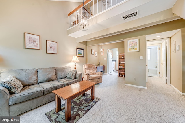 517 Bashford Ln Unit 5, Alexandria, VA 22314 - carpeted living room featuring baseboards and a chandelier