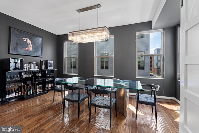 1424 S 4th St, Philadelphia, PA 19147 - dining area featuring an inviting chandelier, baseboards, and wood finished floors