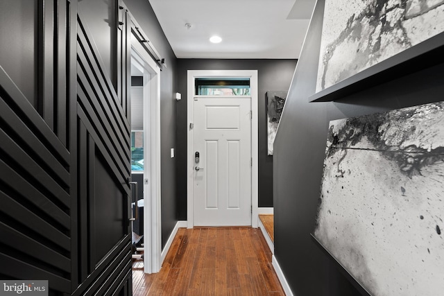 1424 S 4th St, Philadelphia, PA 19147 - doorway featuring dark wood-style flooring, a barn door, and baseboards