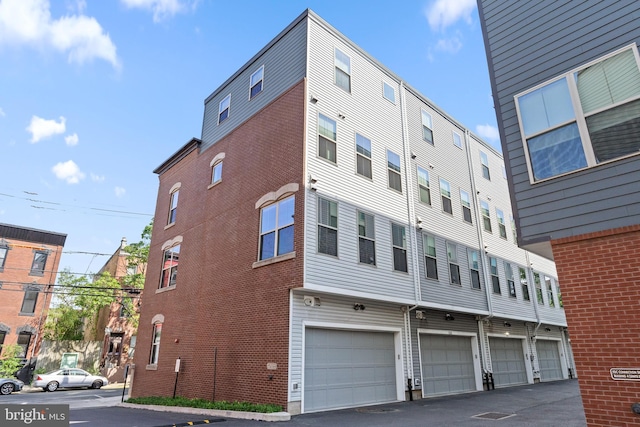 1424 S 4th St, Philadelphia, PA 19147 - view of building exterior featuring an attached garage