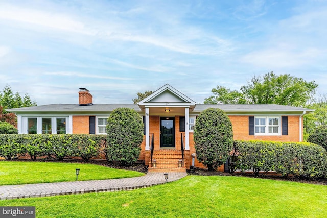 817 Golden Arrow St, Great Falls, VA 22066 - ranch-style home featuring brick siding, a front yard, and a chimney