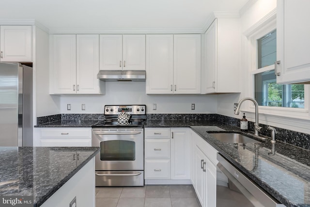 817 Golden Arrow St, Great Falls, VA 22066 - kitchen featuring stainless steel appliances, under cabinet range hood, a sink, white cabinetry, and light tile patterned floors
