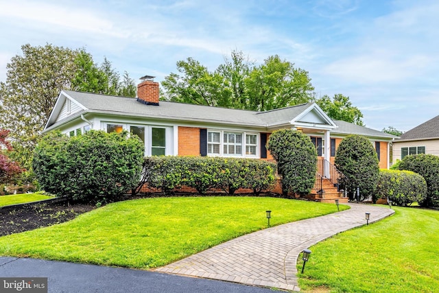 817 Golden Arrow St, Great Falls, VA 22066 - view of front of house with a chimney, a front lawn, and brick siding