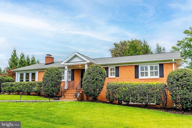 817 Golden Arrow St, Great Falls, VA 22066 - single story home with brick siding, a front yard, and a chimney
