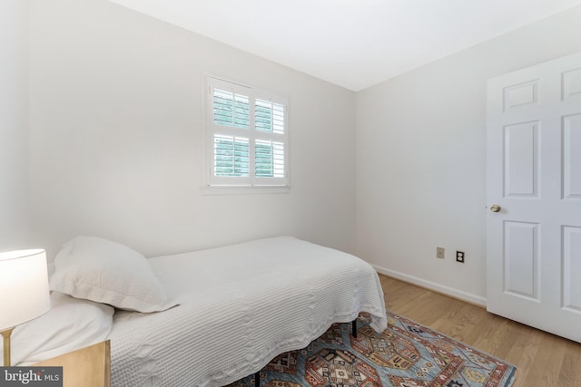 817 Golden Arrow St, Great Falls, VA 22066 - bedroom with wood finished floors and baseboards