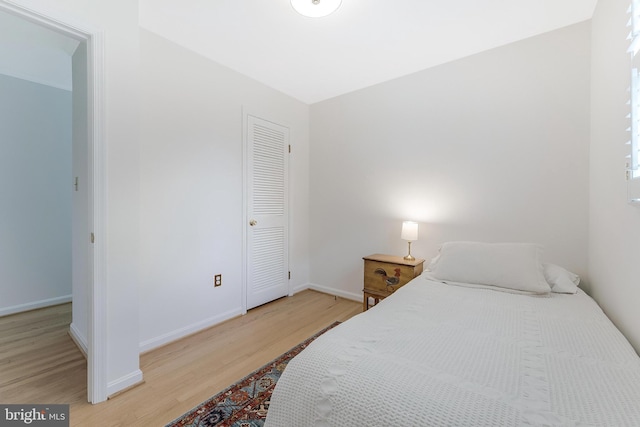 817 Golden Arrow St, Great Falls, VA 22066 - bedroom with light wood-style floors and baseboards
