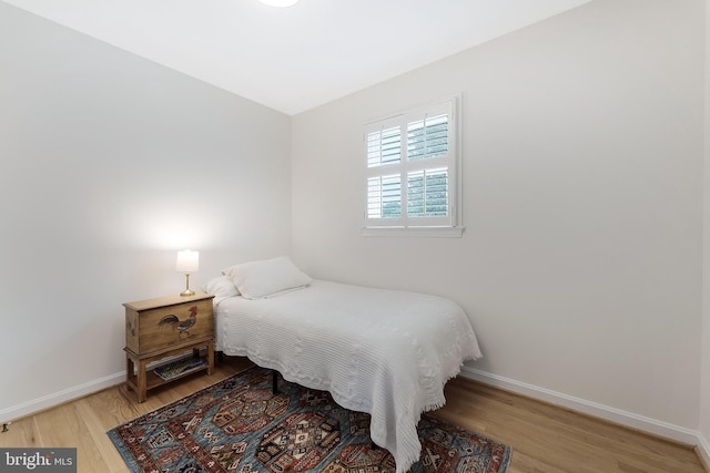 817 Golden Arrow St, Great Falls, VA 22066 - bedroom featuring wood finished floors and baseboards