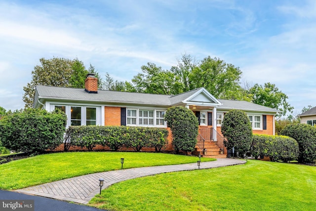 817 Golden Arrow St, Great Falls, VA 22066 - view of front of property with a front lawn, brick siding, and a chimney