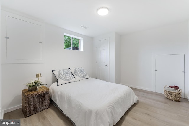 817 Golden Arrow St, Great Falls, VA 22066 - bedroom featuring light wood-style floors and baseboards