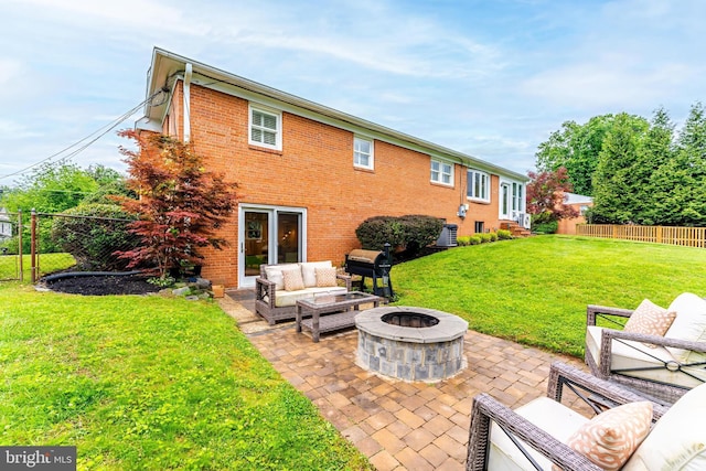 817 Golden Arrow St, Great Falls, VA 22066 - rear view of house featuring an outdoor living space with a fire pit, a patio area, and brick siding