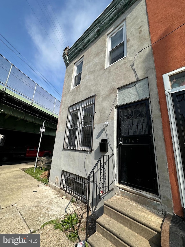 1047 W Nevada St, Philadelphia, PA 19133 - property entrance with stucco siding