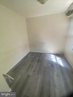1047 W Nevada St, Philadelphia, PA 19133 - spare room with baseboards and dark wood-style floors