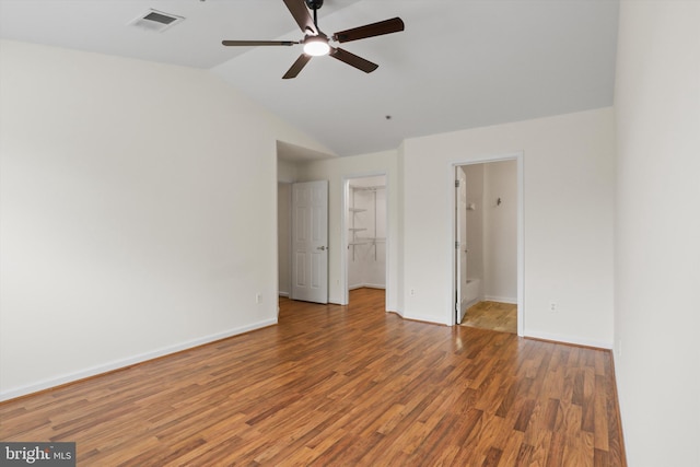 11014 Koman Cir Unit 304, Manassas, VA 20109 - spare room with lofted ceiling, wood finished floors, visible vents, a ceiling fan, and baseboards