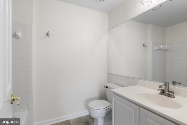 11014 Koman Cir Unit 304, Manassas, VA 20109 - bathroom featuring toilet, baseboards, vanity, and shower / washtub combination
