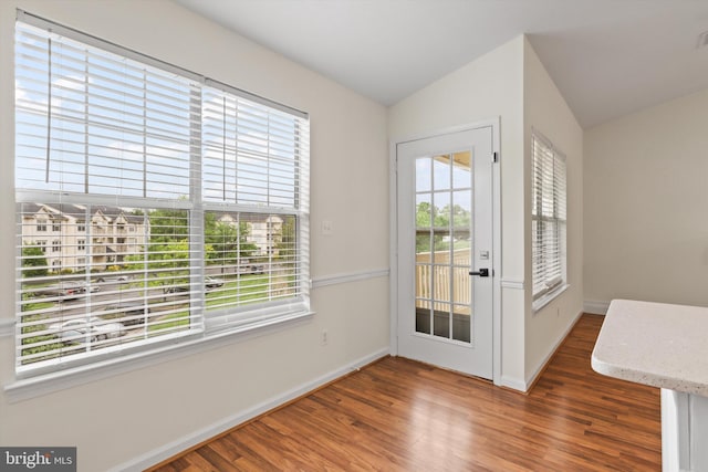 11014 Koman Cir Unit 304, Manassas, VA 20109 - doorway to outside with vaulted ceiling, baseboards, and wood finished floors