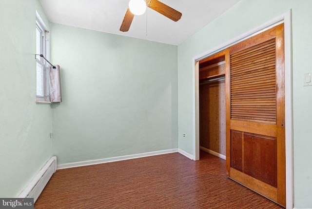 unfurnished bedroom featuring ceiling fan, baseboard heating, baseboards, a closet, and carpet flooring