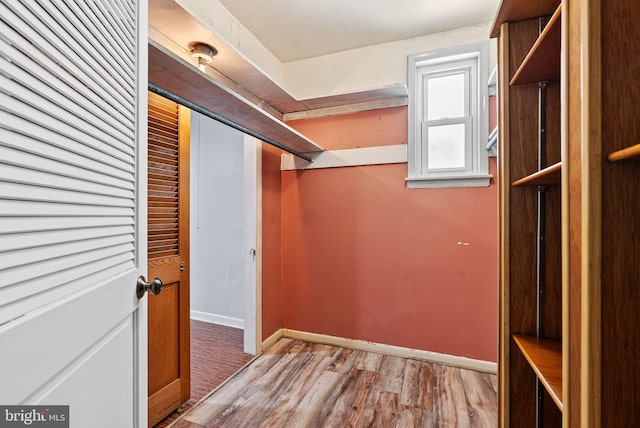spacious closet with wood finished floors