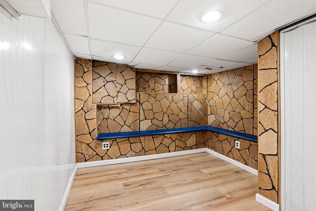 interior space featuring baseboards and wood finished floors