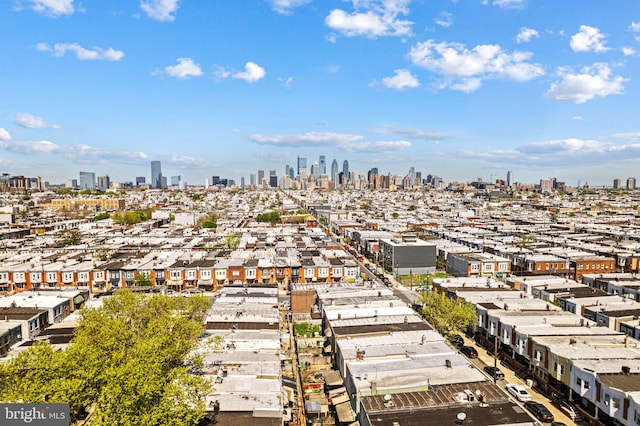 birds eye view of property with a view of city