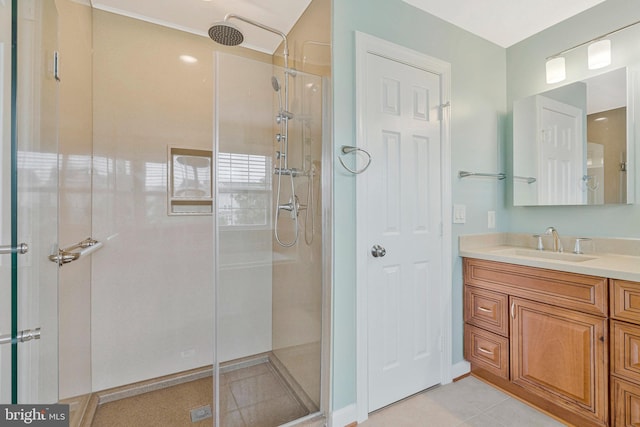 bathroom with vanity, tile patterned floors, and a stall shower