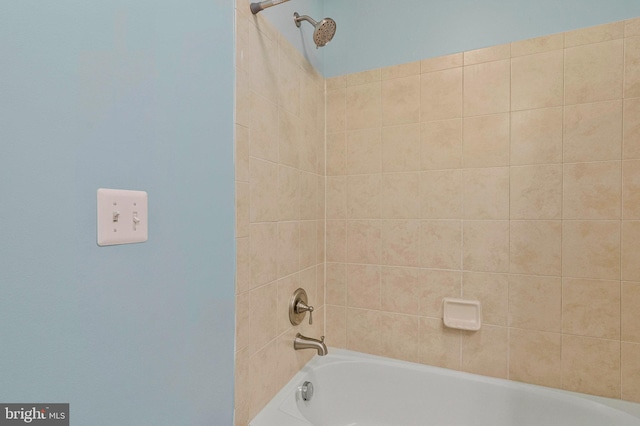 bathroom with bathing tub / shower combination