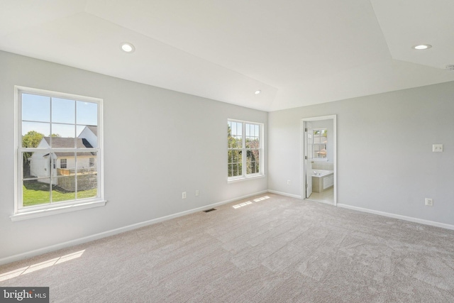 spare room featuring carpet flooring, recessed lighting, baseboards, and visible vents