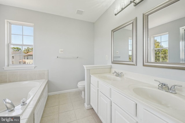 full bathroom with baseboards, a sink, tile patterned flooring, and a garden tub