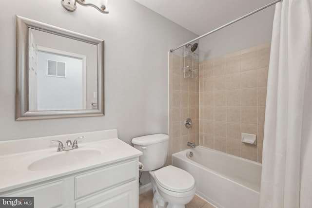 bathroom with vanity, toilet, visible vents, and shower / tub combo