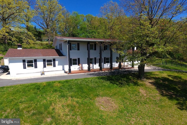 view of front of home featuring a front lawn and stucco siding
