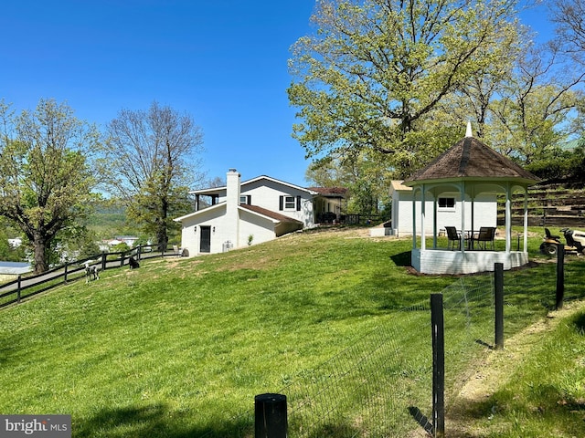 view of yard featuring a gazebo and fence