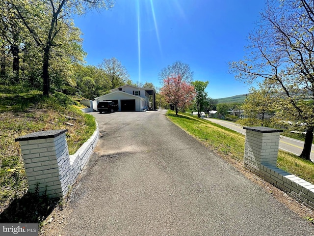 view of front of property with a garage and driveway