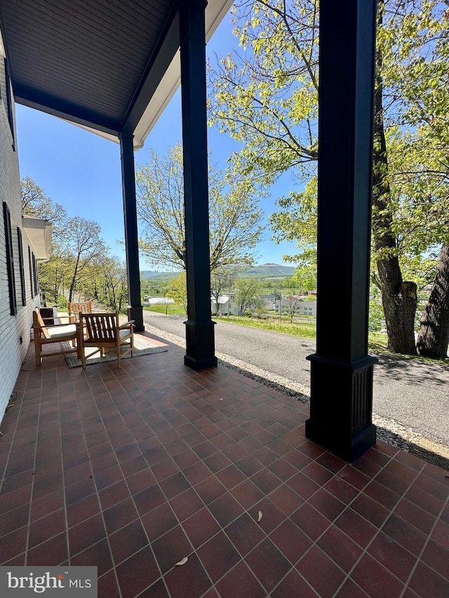 view of patio featuring a porch