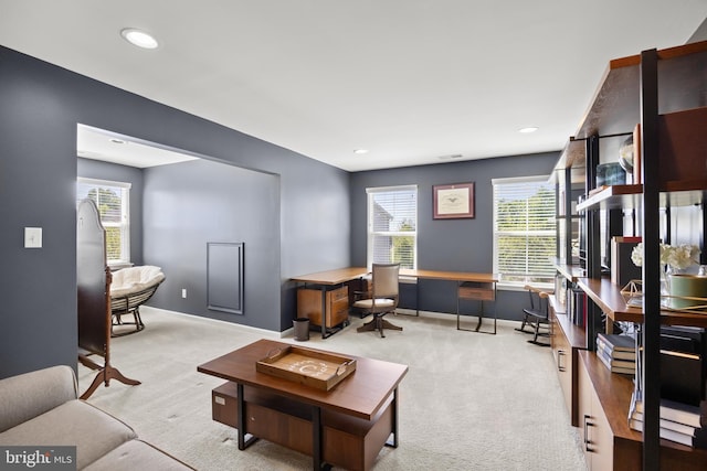 office space featuring recessed lighting, baseboards, and light carpet
